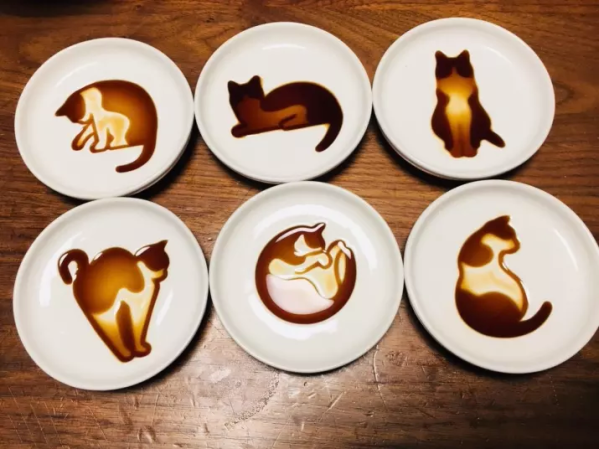 soy sauce art in shape of cats